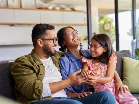 Parents with daughter in their home. 